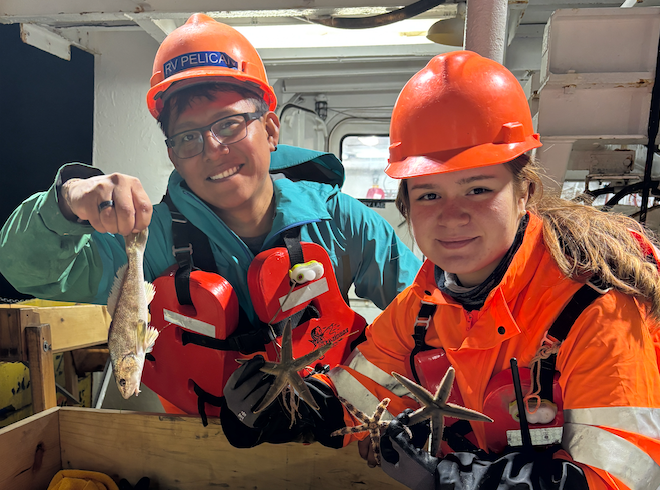 Graduate students pose with trawl catch. 