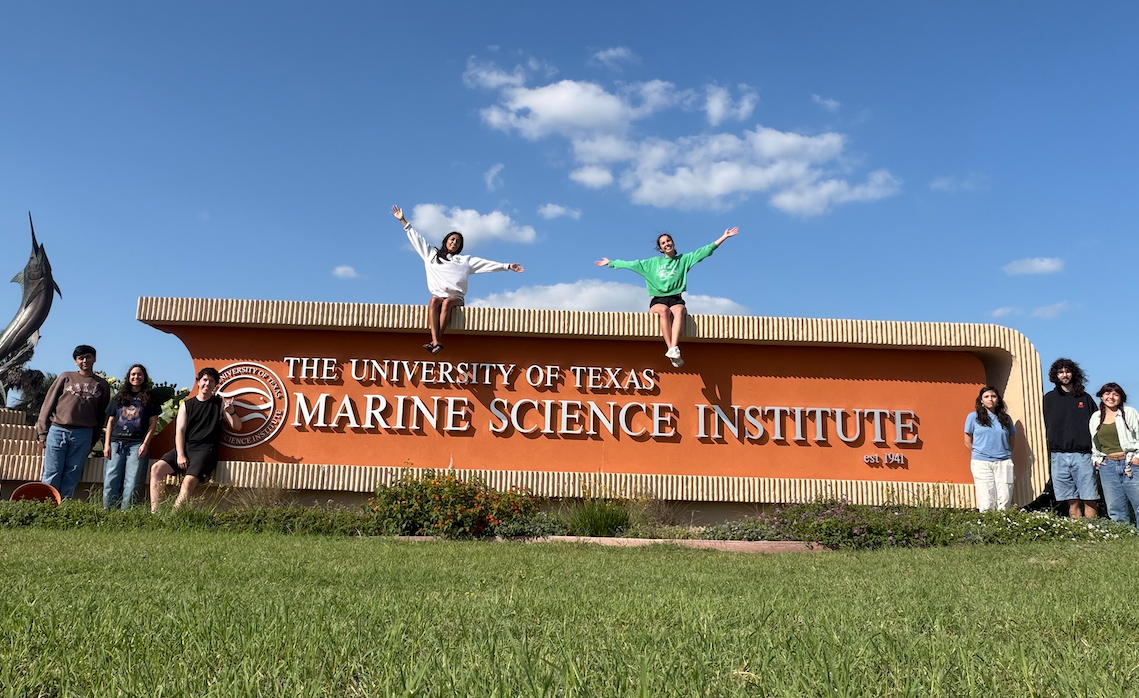 Semester by the Sea students in front of UTMSI sign. 